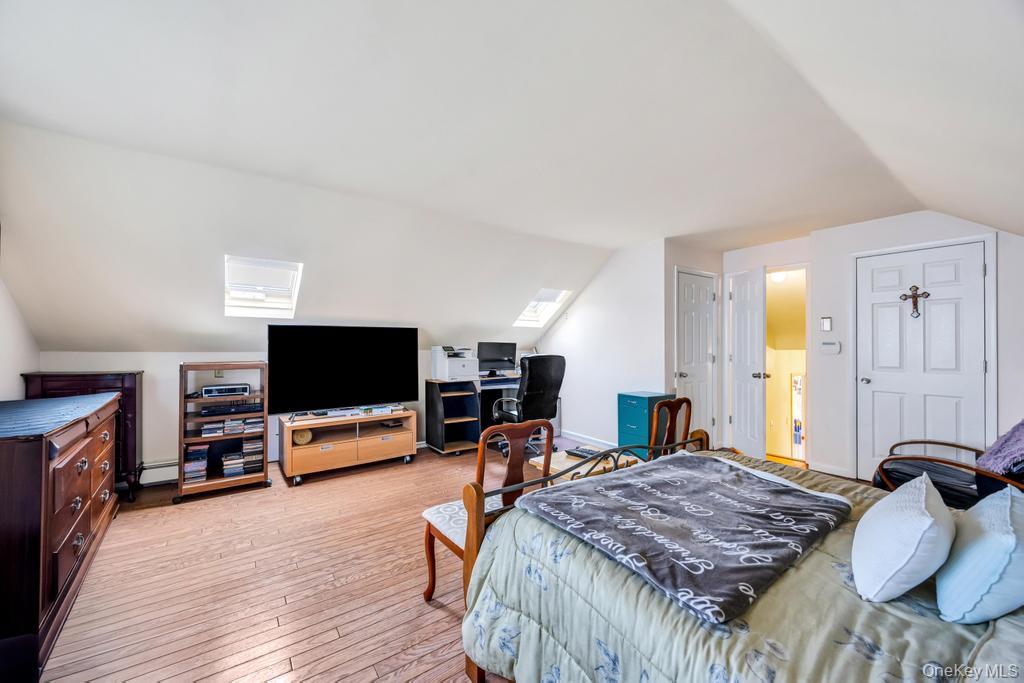 7 North Terrace Place Valley Stream, NY 11580 - Photo 25 of 40 a bedroom with a bed and a flat screen tv