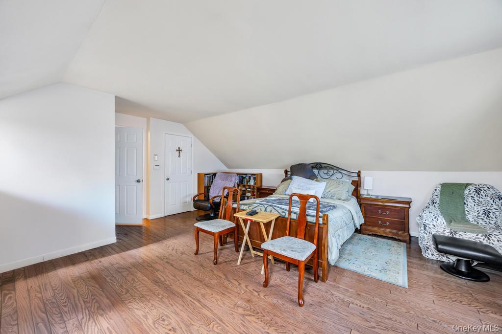 7 North Terrace Place Valley Stream, NY 11580 - Photo 27 of 40 a living room with furniture and a wooden floor