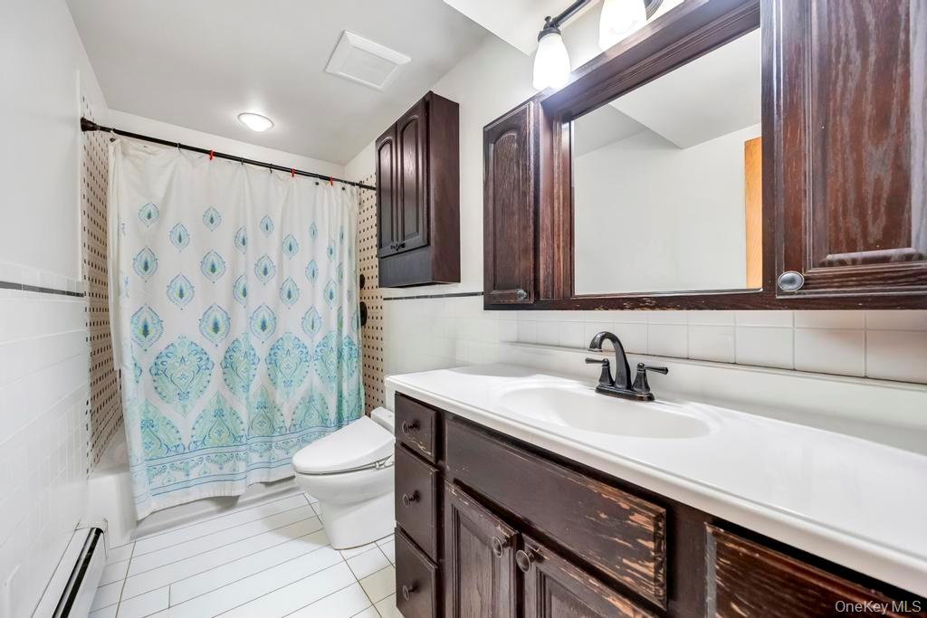7 North Terrace Place Valley Stream, NY 11580 - Photo 28 of 40 a bathroom with a sink and a mirror