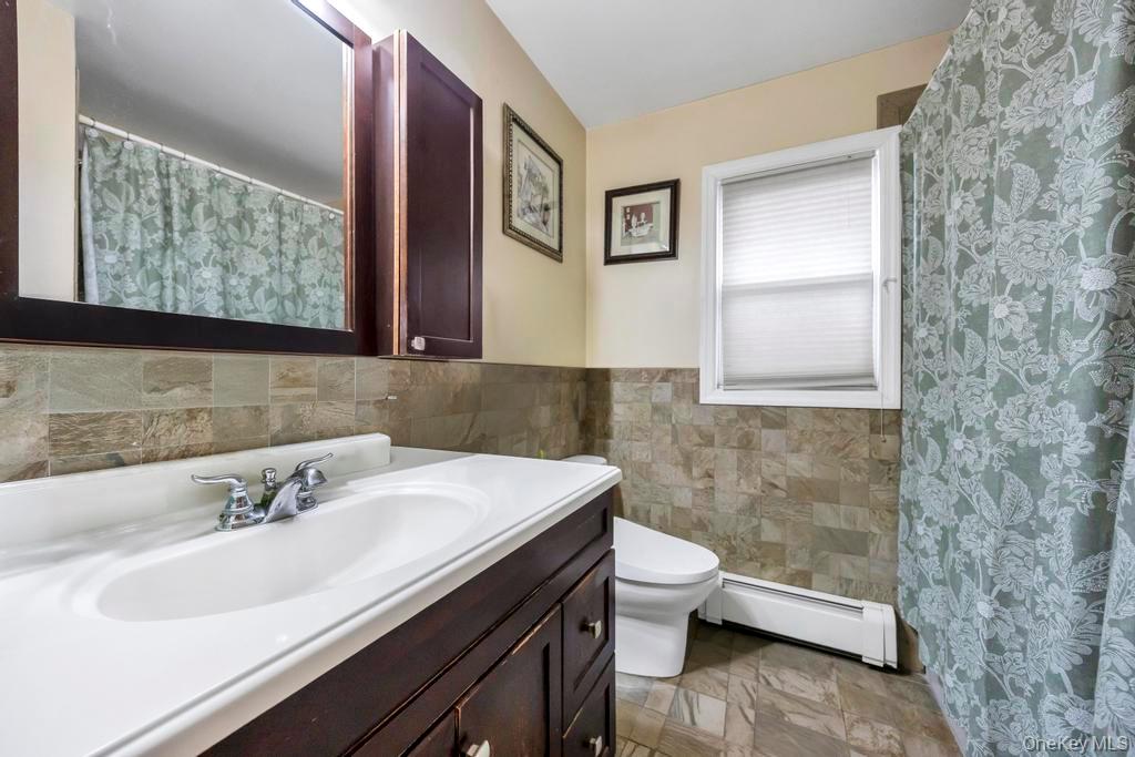 7 North Terrace Place Valley Stream, NY 11580 - Photo 29 of 40 a bathroom with a sink and a mirror