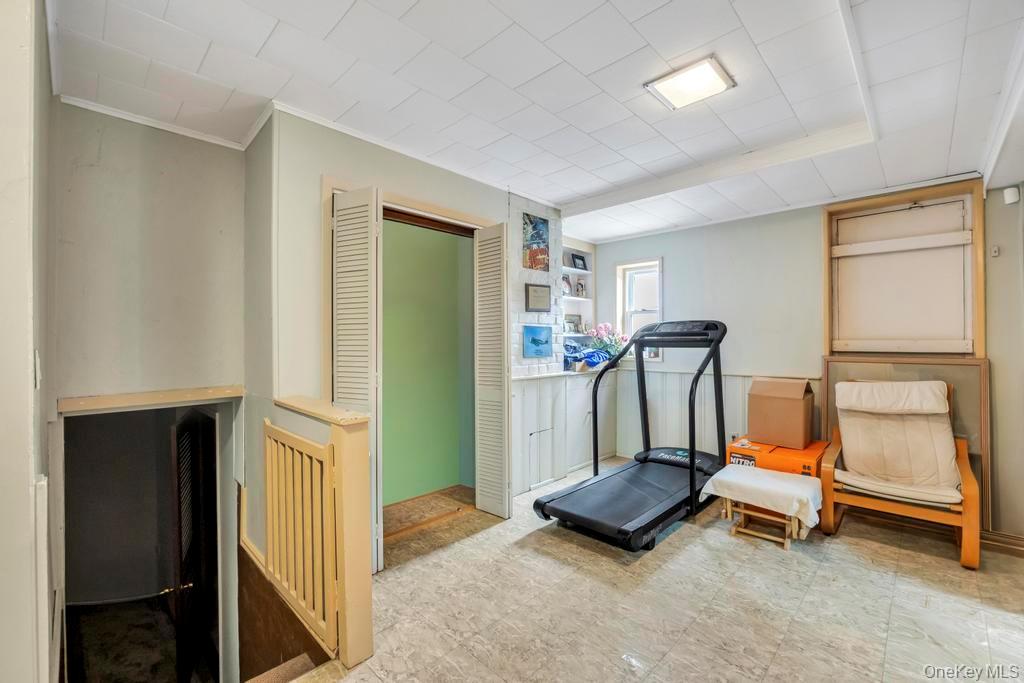 7 North Terrace Place Valley Stream, NY 11580 - Photo 31 of 40 a room with gym equipment and a walk in closet