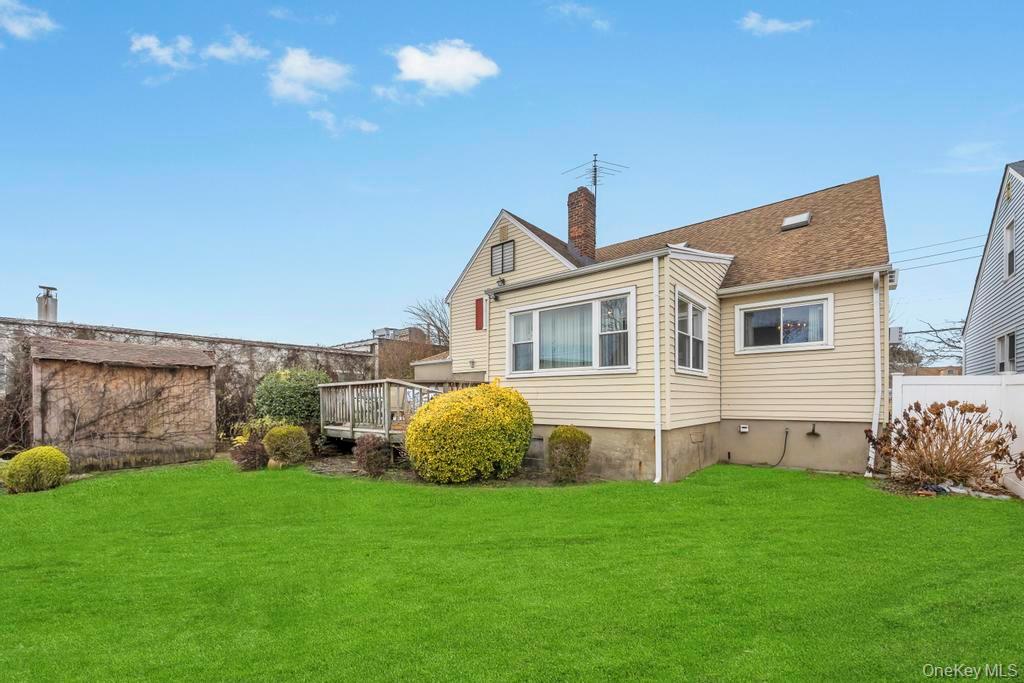 7 North Terrace Place Valley Stream, NY 11580 - Photo 5 of 40 a view of a backyard with plants and a garden