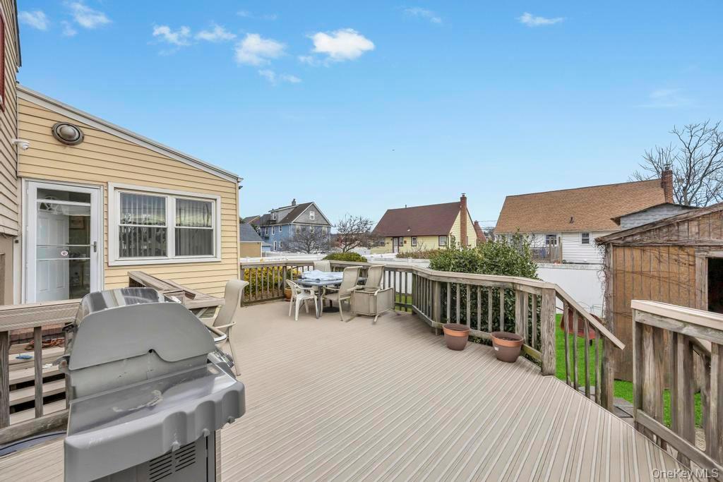 7 North Terrace Place Valley Stream, NY 11580 - Photo 7 of 40 a view of a house with wooden deck and furniture