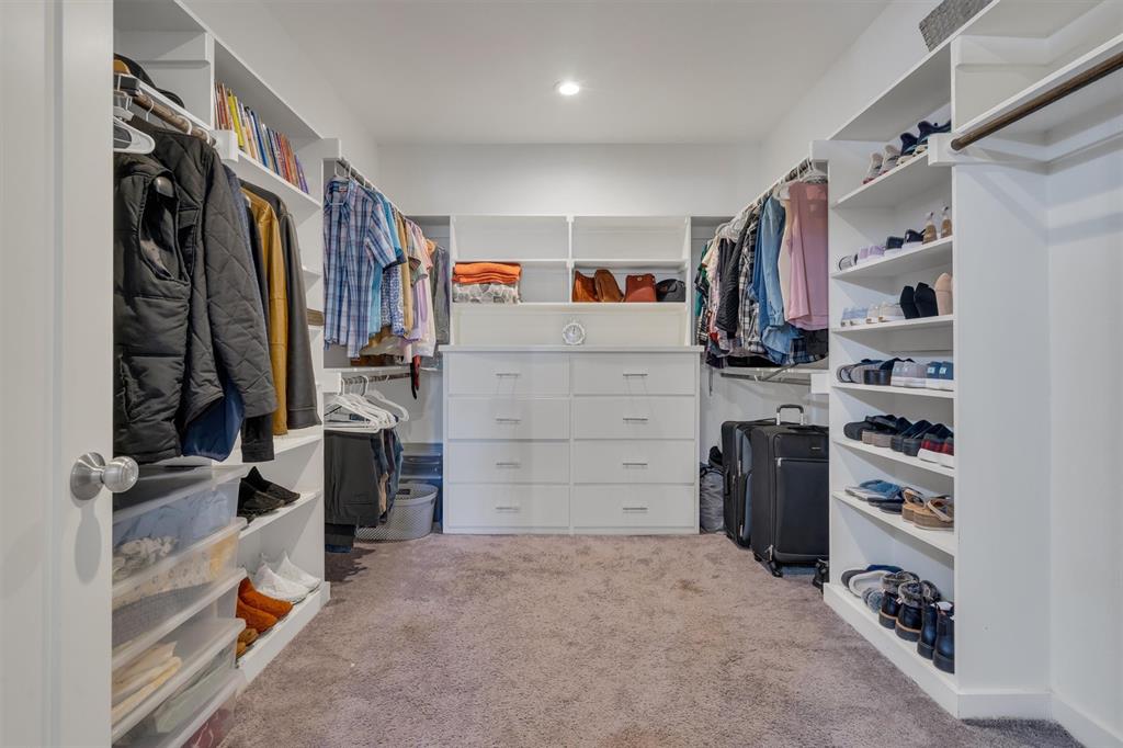 300 West Bell Street Everman, TX 76140 - Photo 17 of 28 a view of walk in closet with clothes and shoes