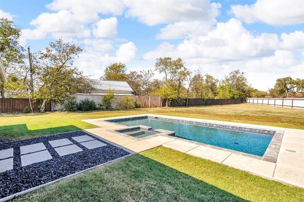 300 West Bell Street Everman, TX 76140 - Photo 27 of 28 a view of a swimming pool with an outdoor space and seating area