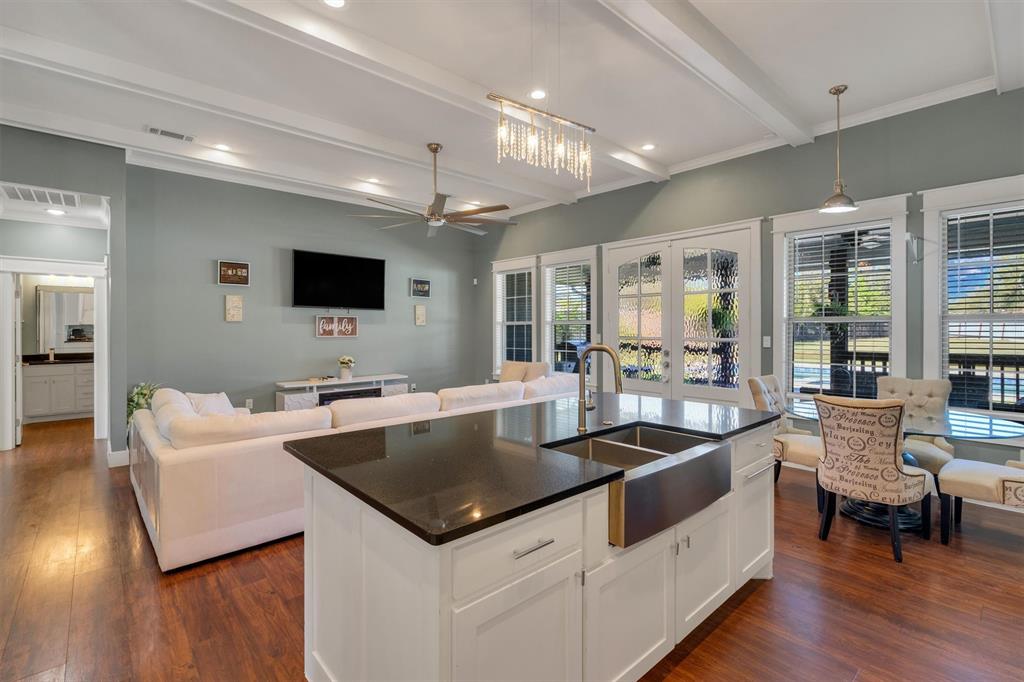 300 West Bell Street Everman, TX 76140 - Photo 28 of 28 a large white kitchen with a large window and stainless steel appliances