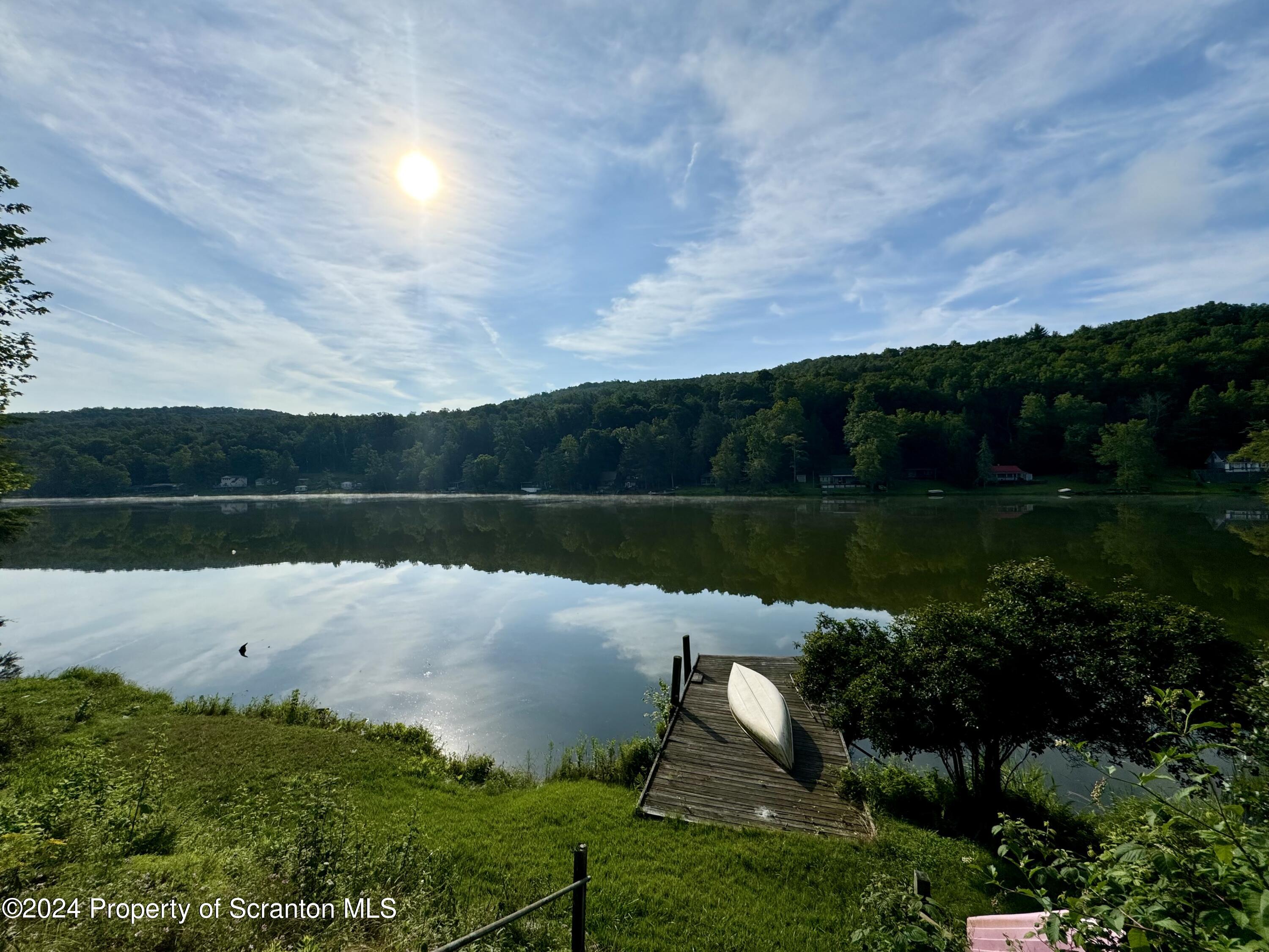 266 Crescent Lake Road Meshoppen, PA 18630 - Photo 1 of 12 a lake view with a big yard