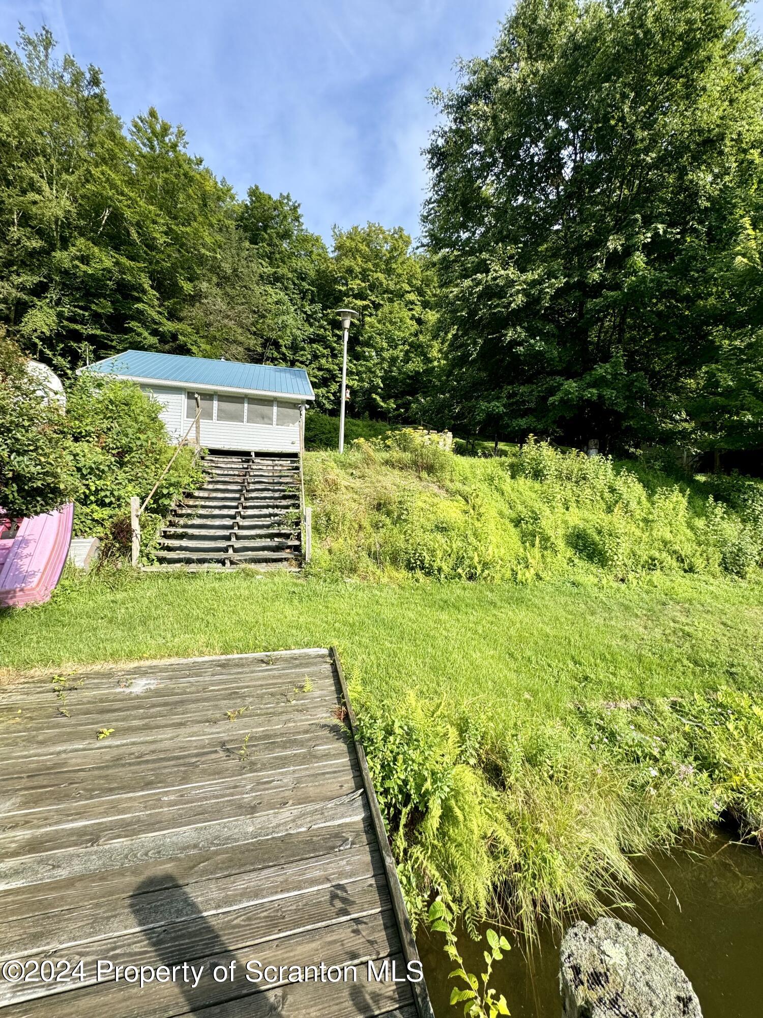 266 Crescent Lake Road Meshoppen, PA 18630 - Photo 3 of 12 a view of backyard with green space