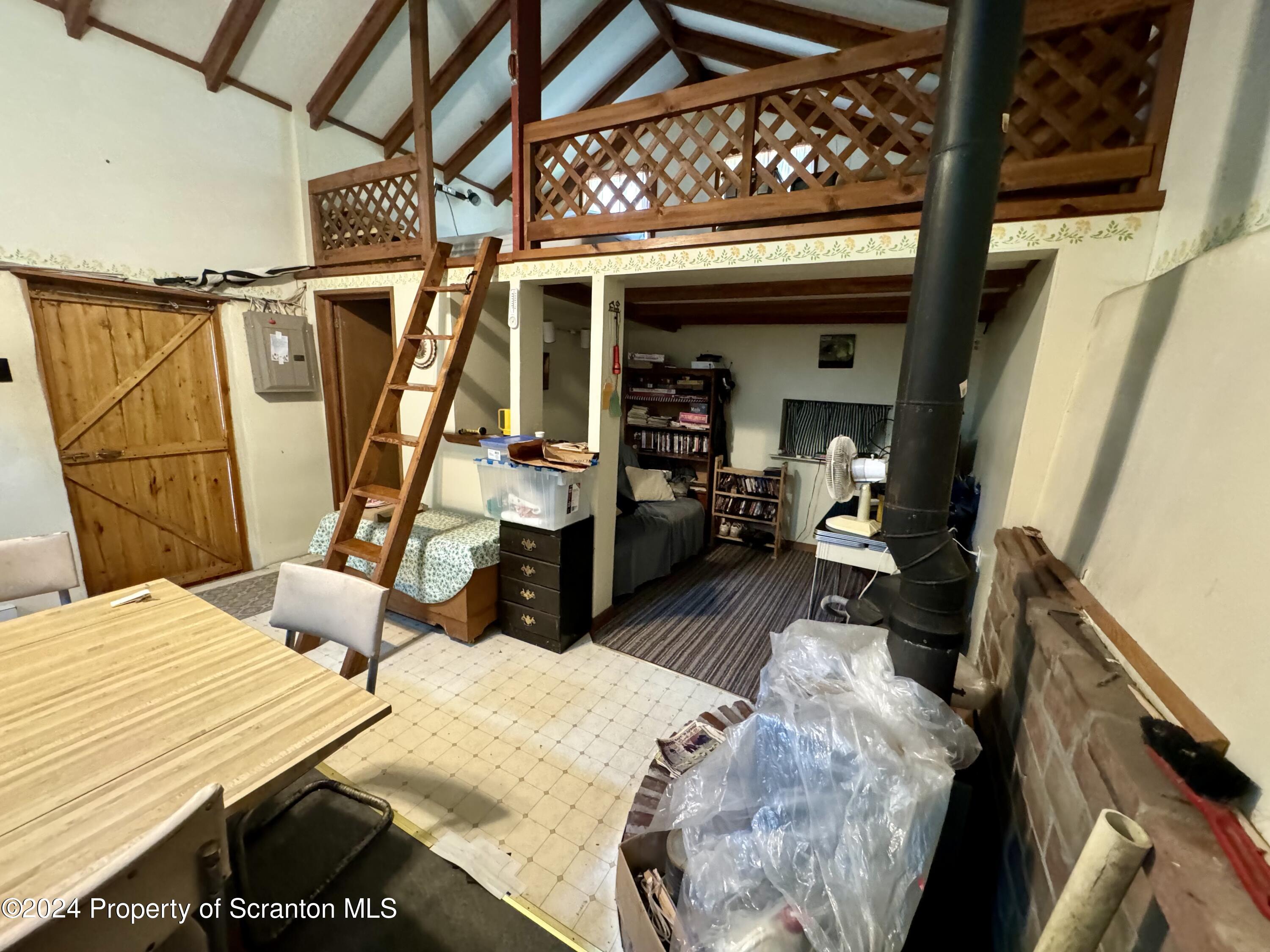 266 Crescent Lake Road Meshoppen, PA 18630 - Photo 7 of 12 a bedroom with a bed and wooden floor
