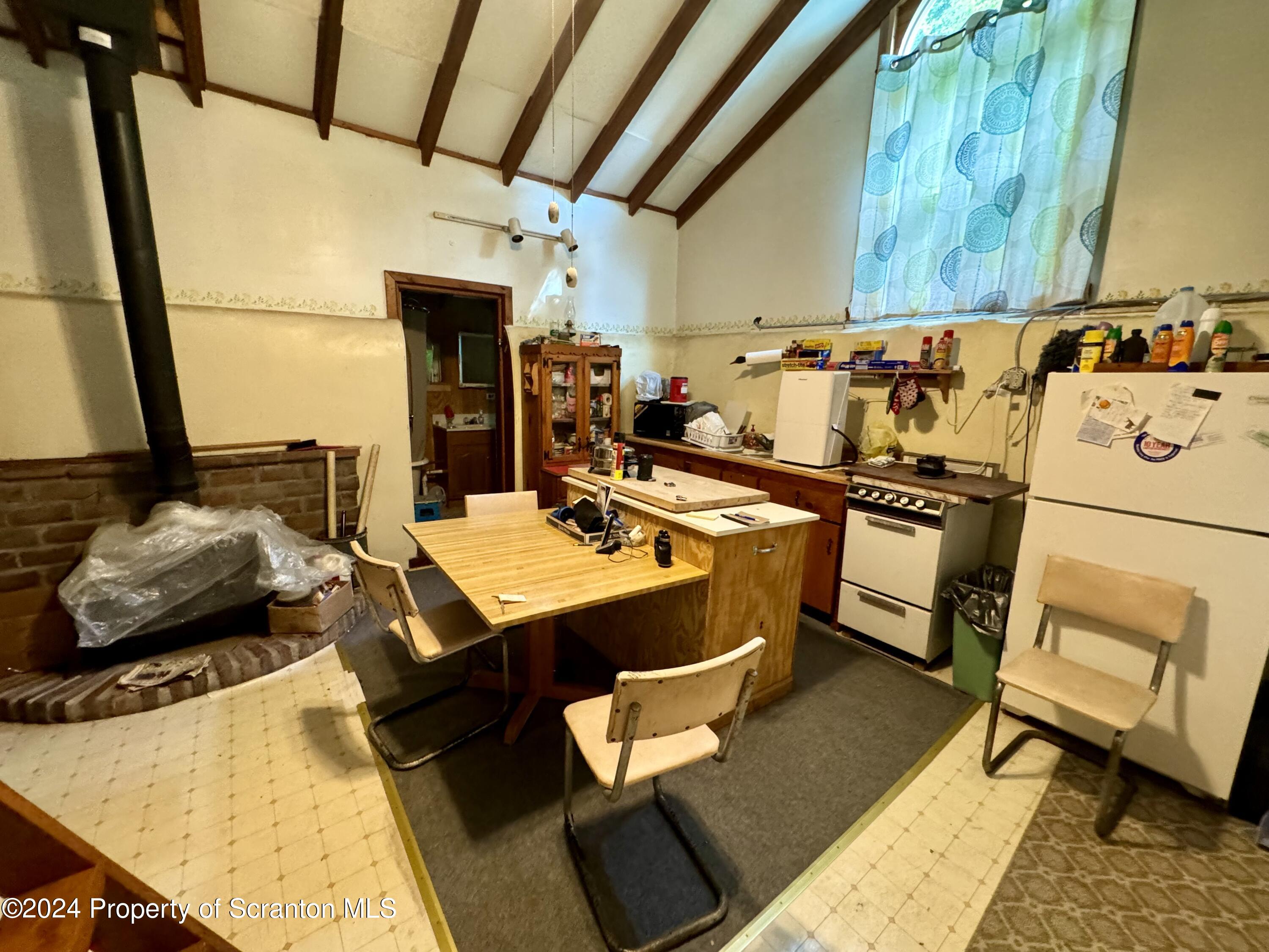 266 Crescent Lake Road Meshoppen, PA 18630 - Photo 8 of 12 a room with table and chairs