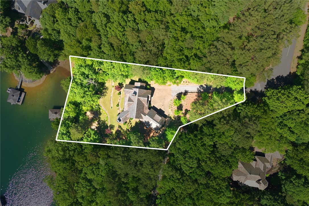 130 River Ridge Road Sunset, SC 29685 - Photo 41 of 47 This private estate features a sprawling residence nestled among lush trees with waterfront access and a private boat dock.