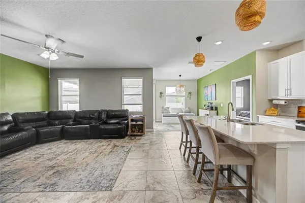 a spacious bathroom with a sink a mirror and a shower