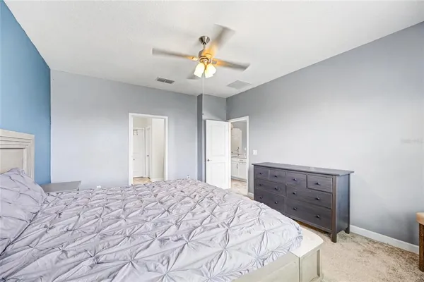 a view of a hallway with wooden floor and closet