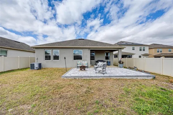 an aerial view of house with yard