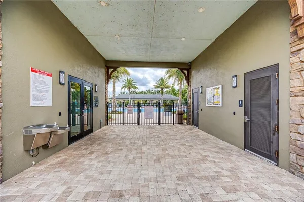 a view of a yard with wooden fence