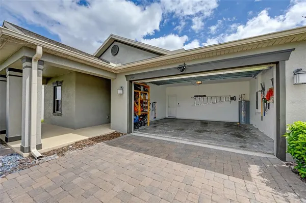 a kitchen with stainless steel appliances granite countertop a stove refrigerator sink and microwave
