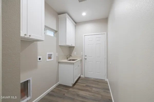 a view of a kitchen cabinets a sink and dishwasher