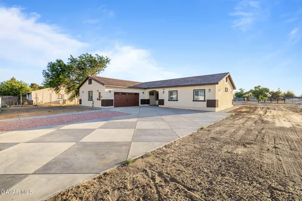 a house view with a backyard space