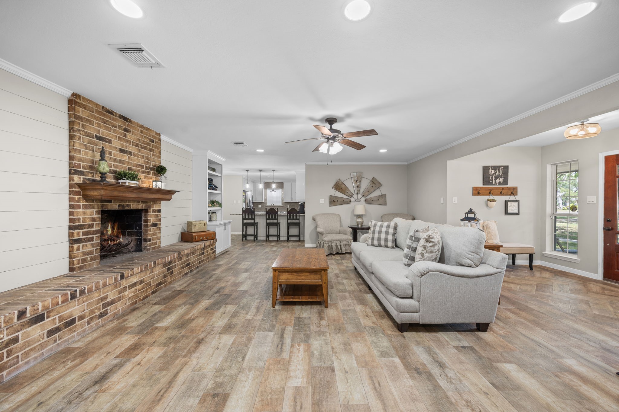 3311 Eula Morgan Road Katy, TX 77493 - Photo 12 of 32 a living room with furniture and a fireplace