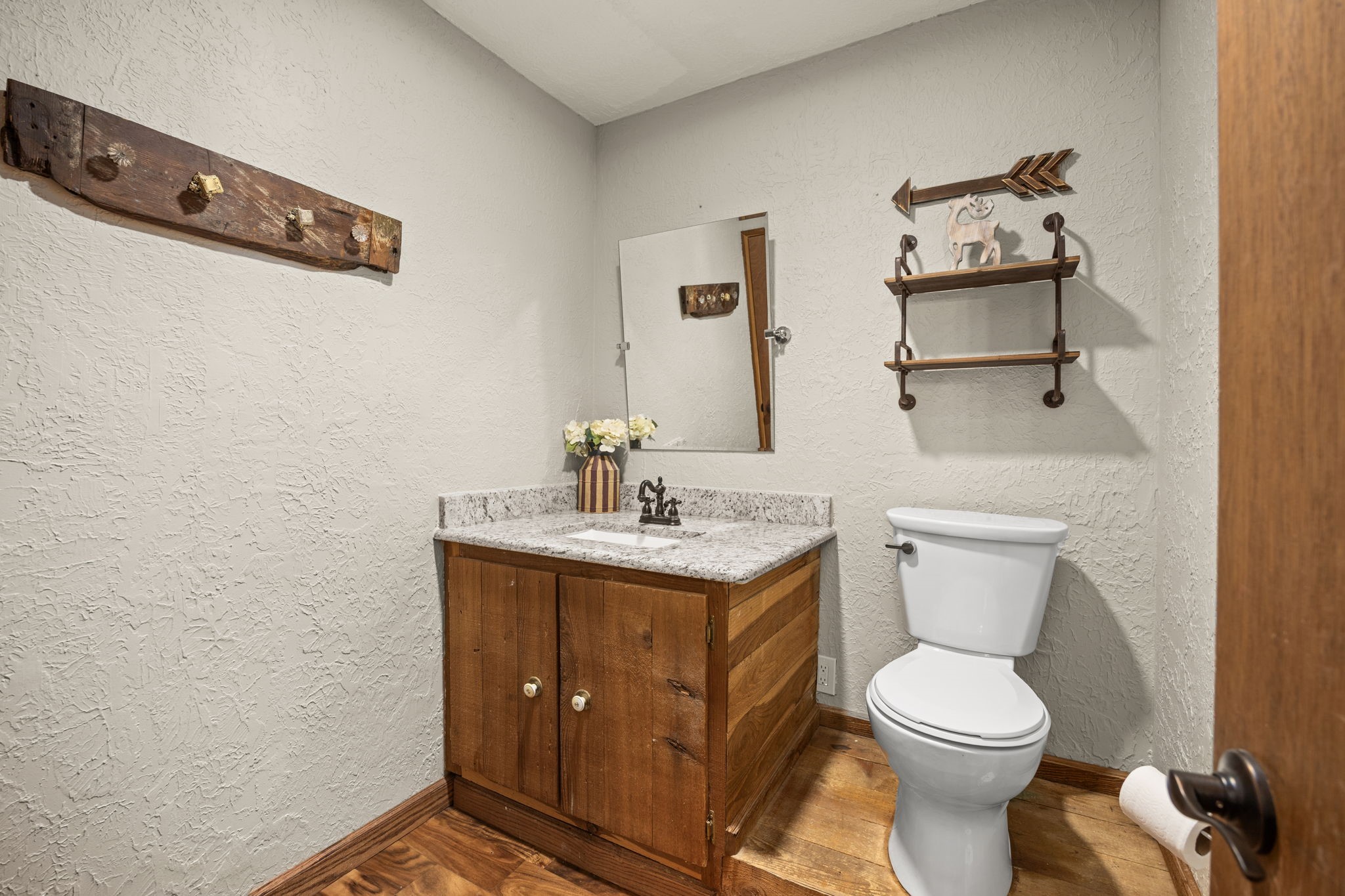 3311 Eula Morgan Road Katy, TX 77493 - Photo 22 of 32 a bathroom with a toilet a sink and mirror