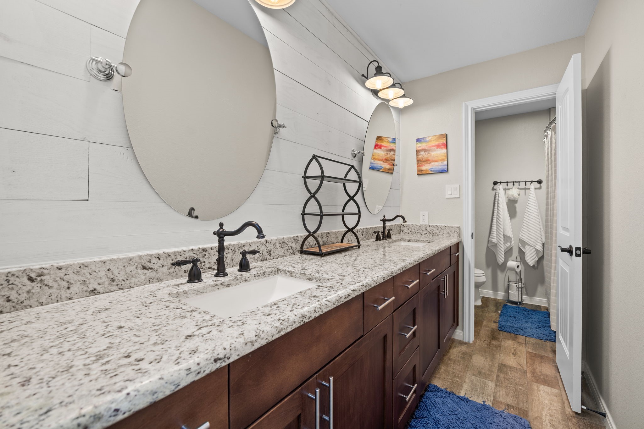 3311 Eula Morgan Road Katy, TX 77493 - Photo 25 of 32 a bathroom with a double vanity sink and a mirror