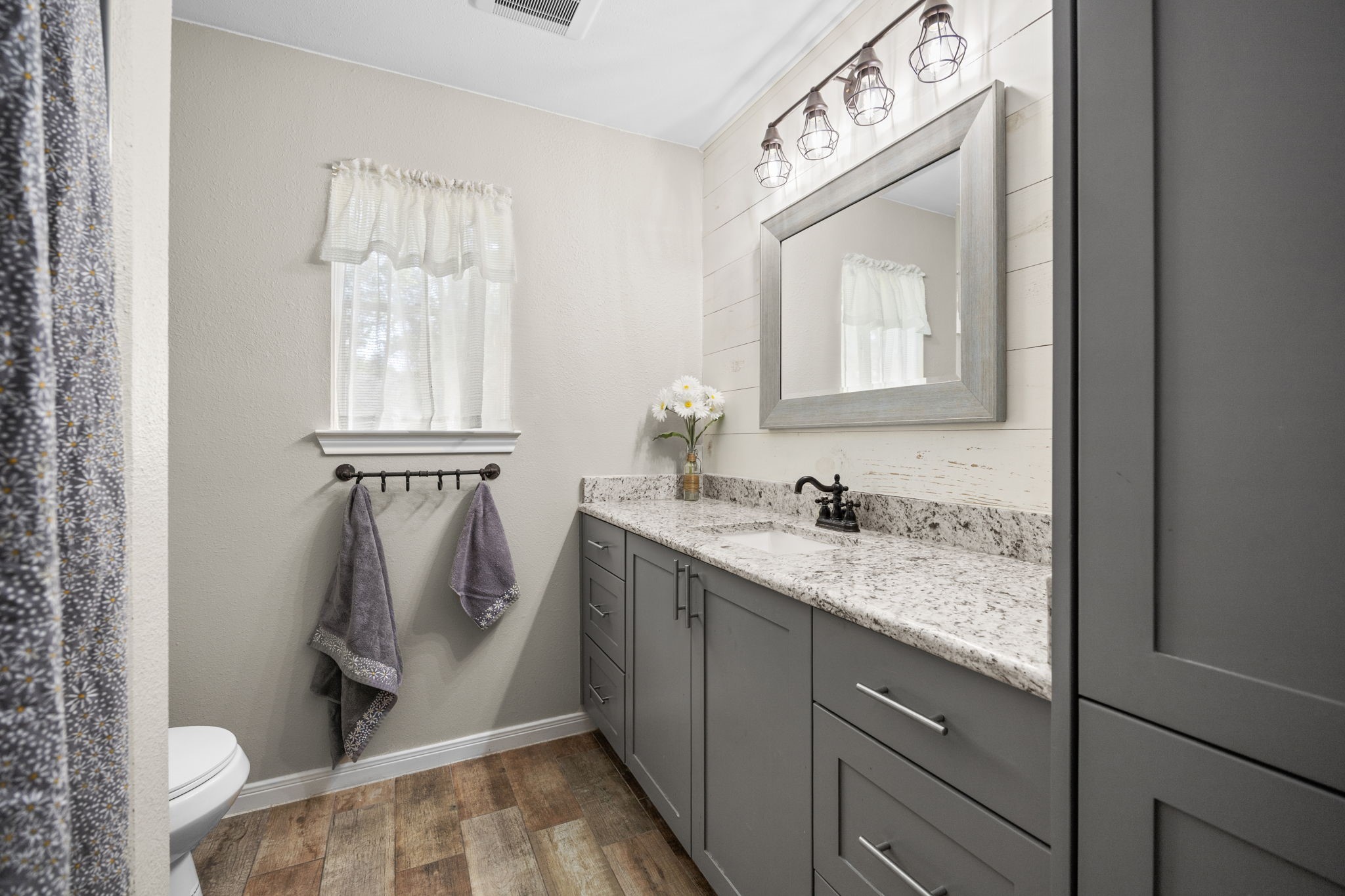 3311 Eula Morgan Road Katy, TX 77493 - Photo 26 of 32 a bathroom with a granite countertop sink and a mirror