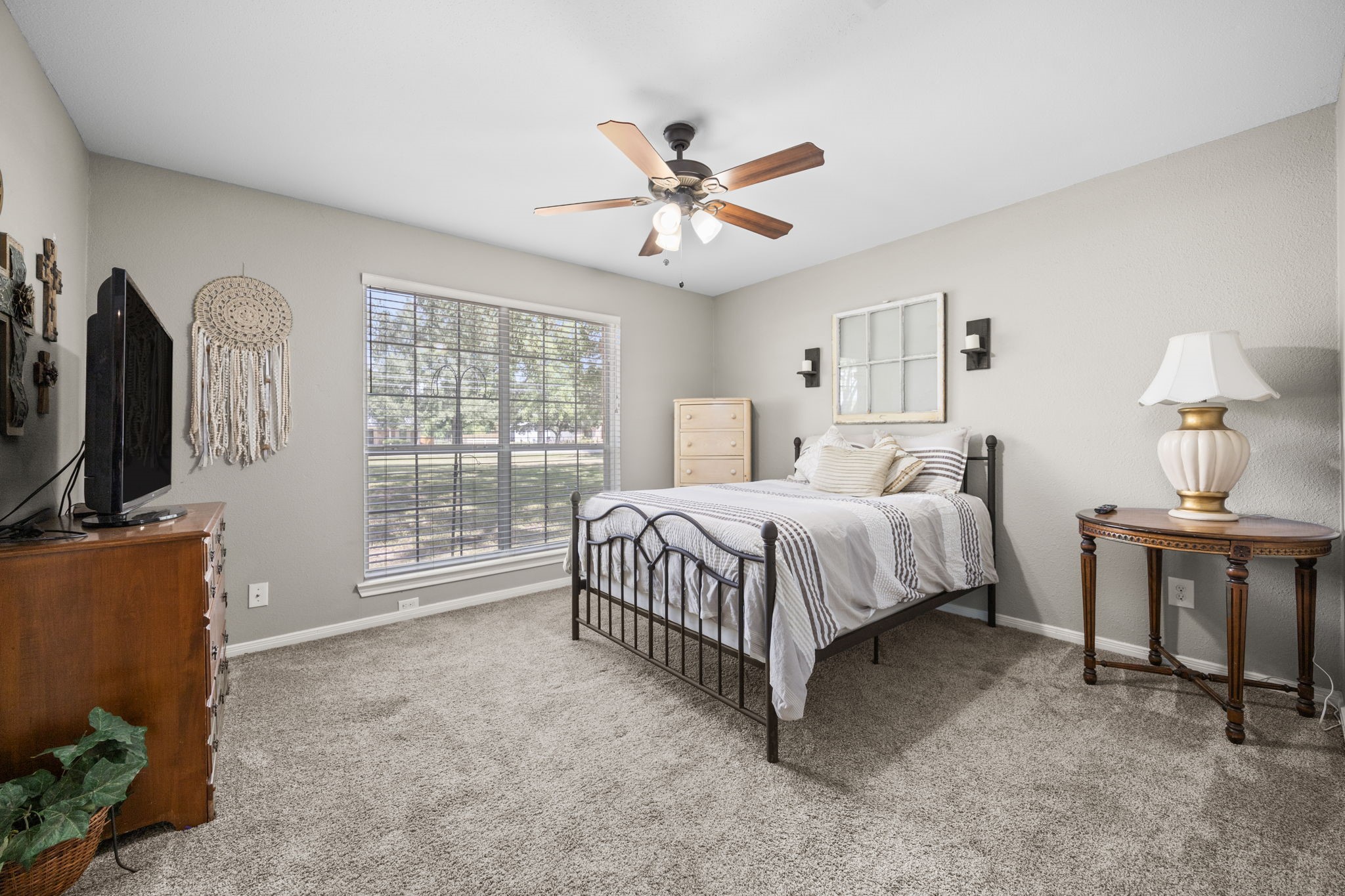 3311 Eula Morgan Road Katy, TX 77493 - Photo 27 of 32 a spacious bedroom with a bed and a flat screen tv