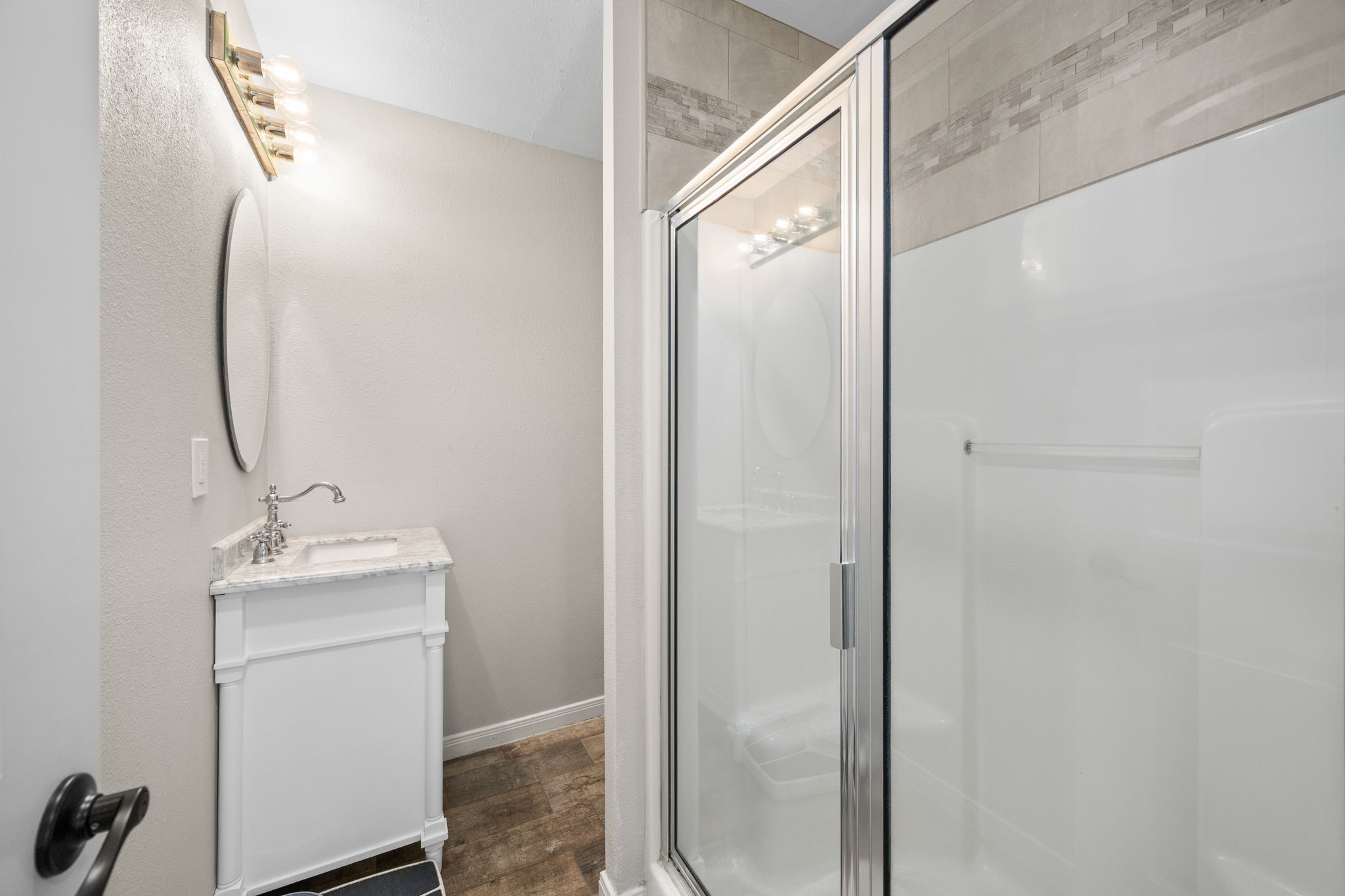 3311 Eula Morgan Road Katy, TX 77493 - Photo 31 of 32 a bathroom with a sink and mirror