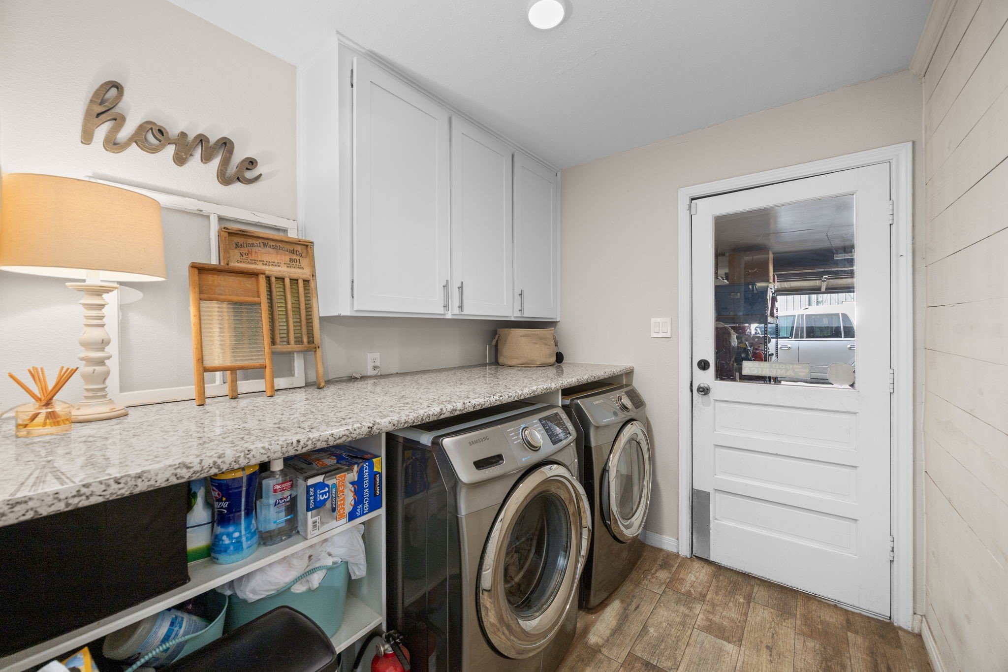 3311 Eula Morgan Road Katy, TX 77493 - Photo 32 of 32 a utility room with granite countertop cabinets washer and dryer