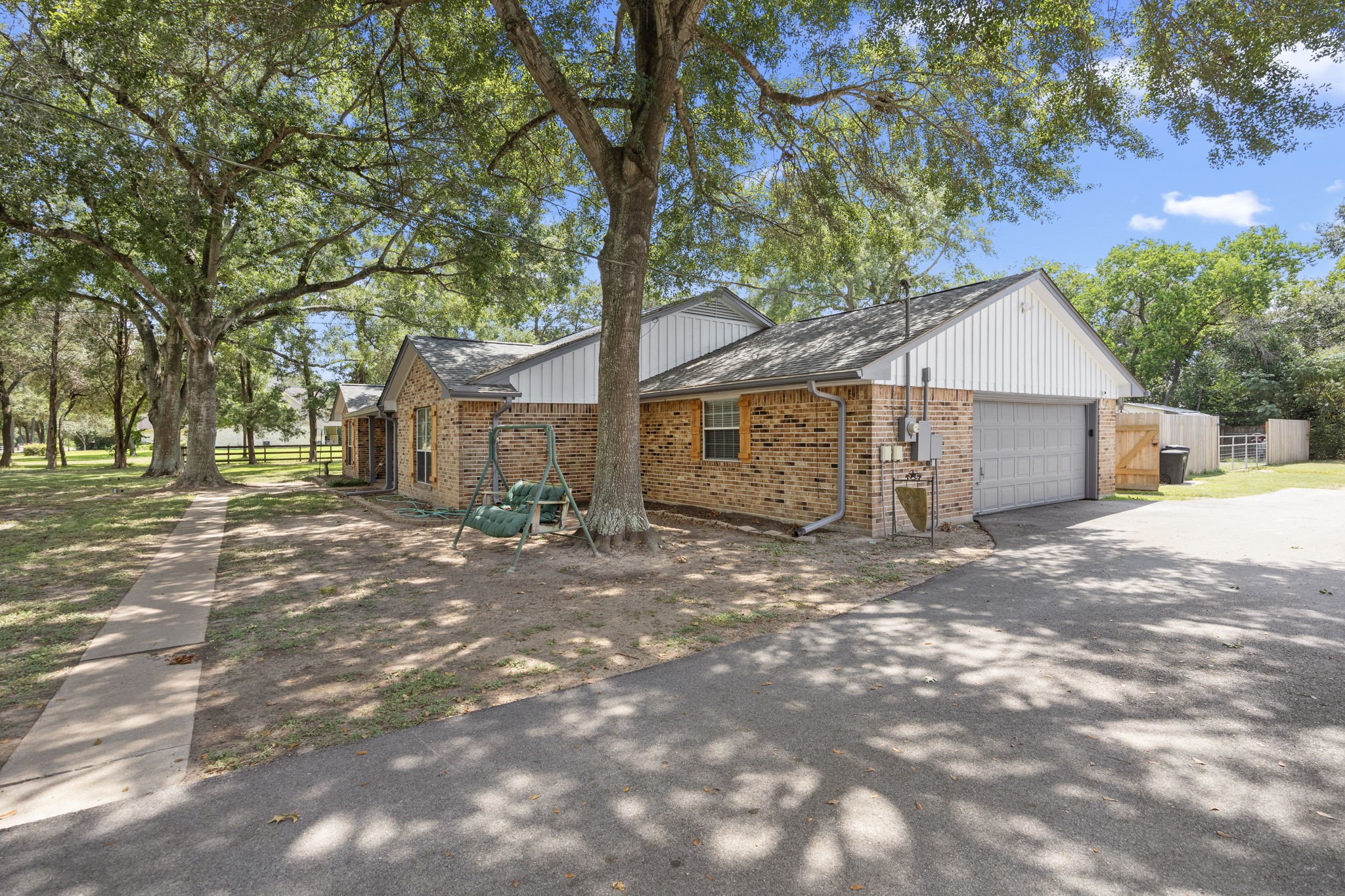 3311 Eula Morgan Road Katy, TX 77493 - Photo 4 of 32 a front view of a house with a yard and garage