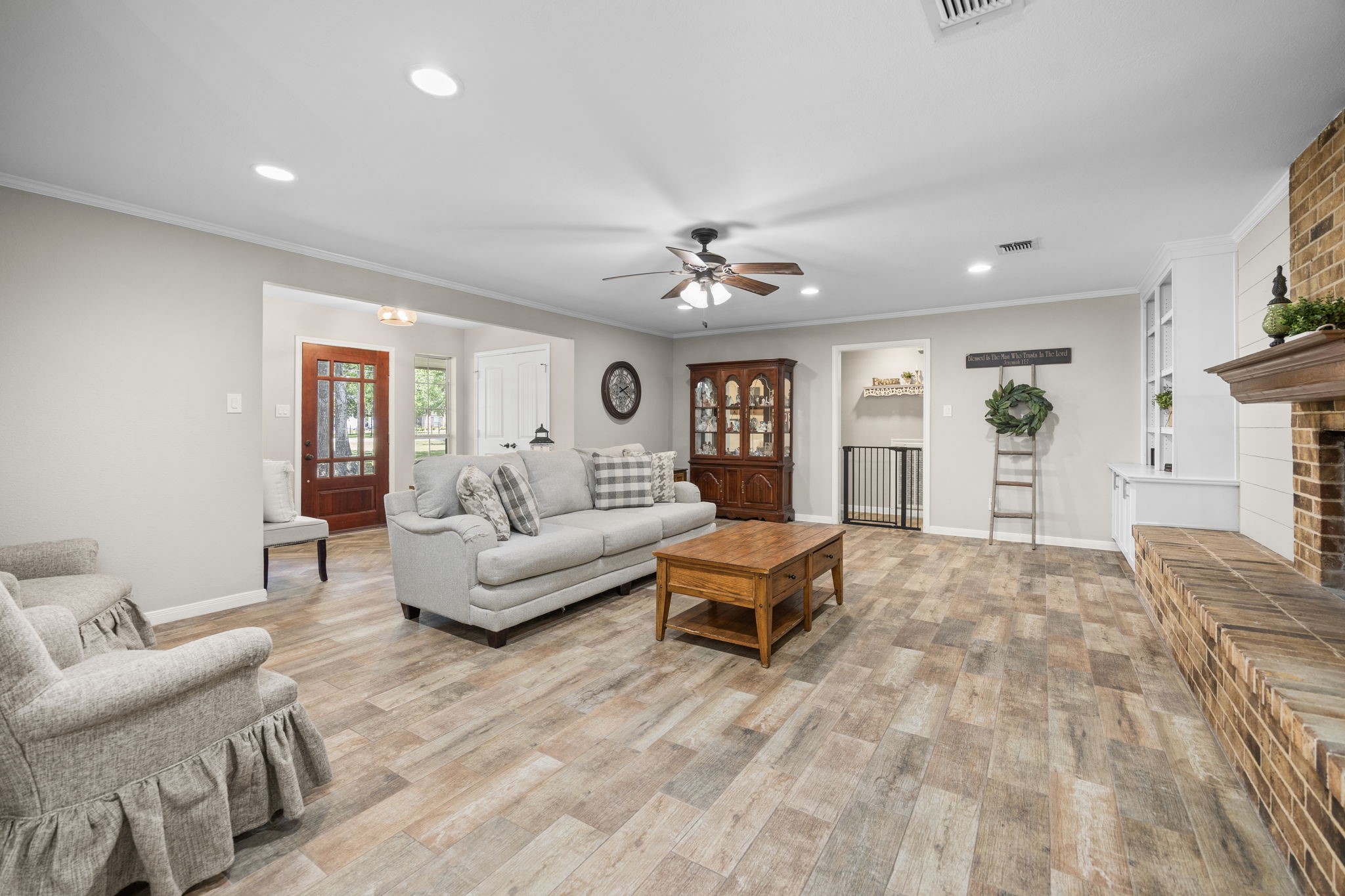 3311 Eula Morgan Road Katy, TX 77493 - Photo 9 of 32 a living room with furniture and a chandelier