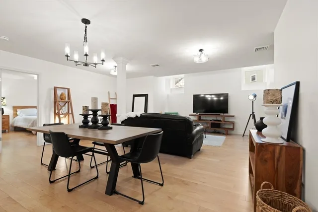 a view of a livingroom with furniture and a flat screen tv