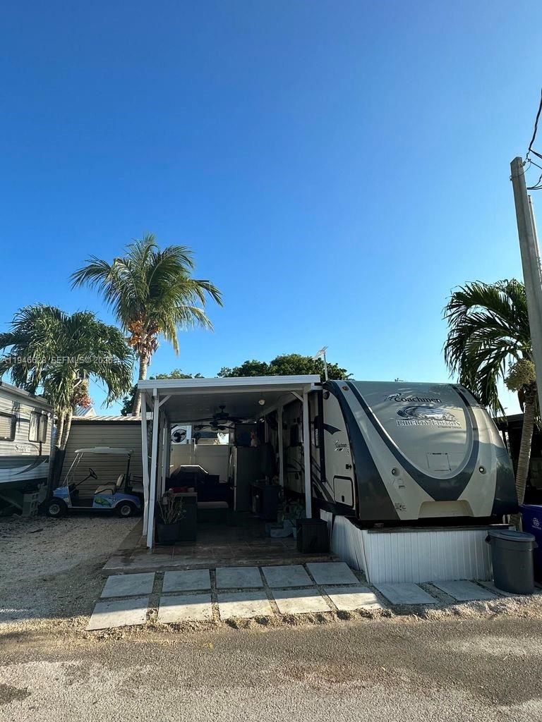 325 Calusa, Unit 9 Key Largo, FL 33037 - Photo 11 of 11 a view of a car parked on the side of the road