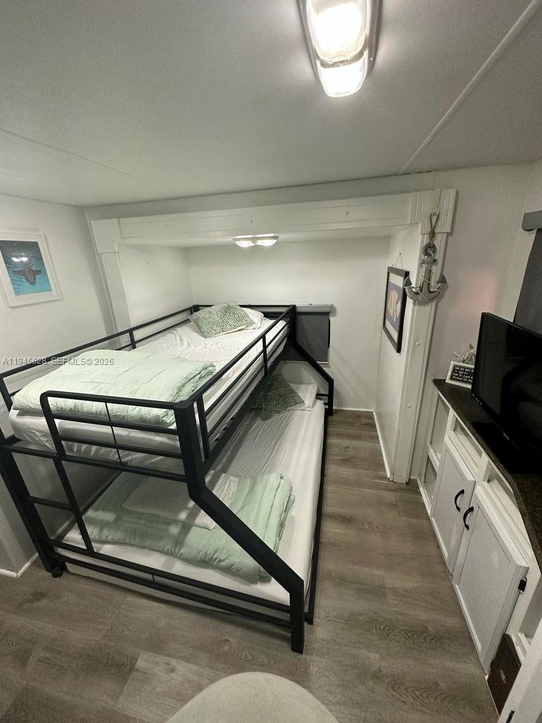 325 Calusa, Unit 9 Key Largo, FL 33037 - Photo 7 of 11 a view of a livingroom with furniture and a window