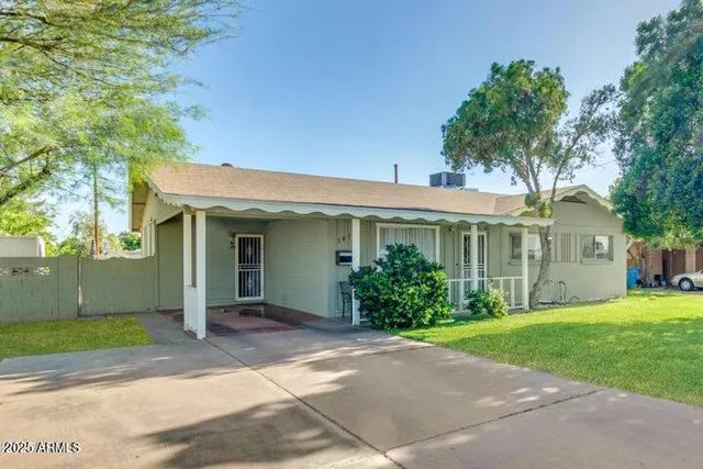 front view of a house with a yard