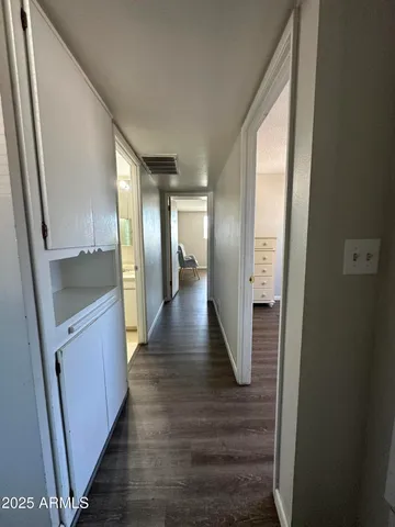 a living room with hard wood floors and a window