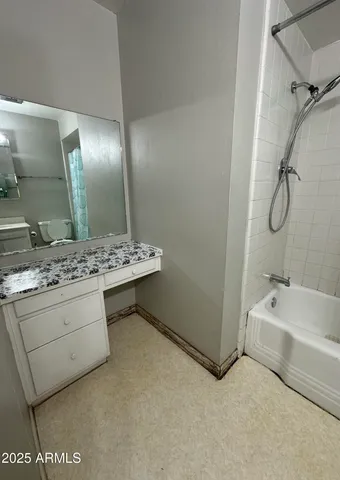 a bedroom with furniture and window