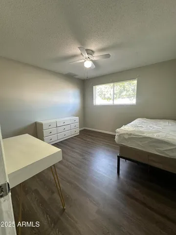 a view of hallway with wooden floor
