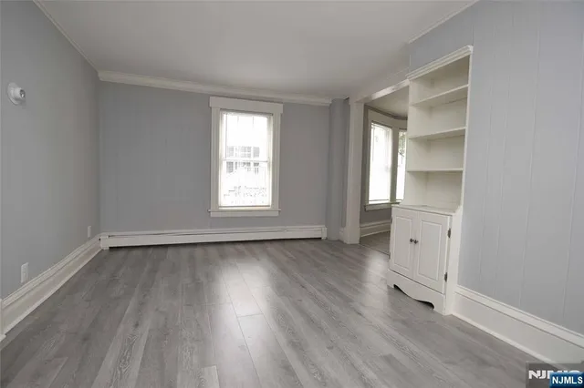 a large white bed in a small room