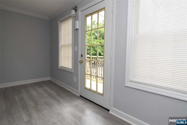 a kitchen with a refrigerator and a stove