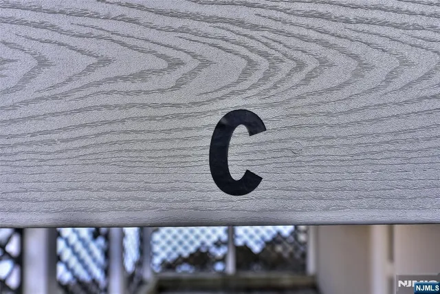 a view of a small space with wooden floor and a window