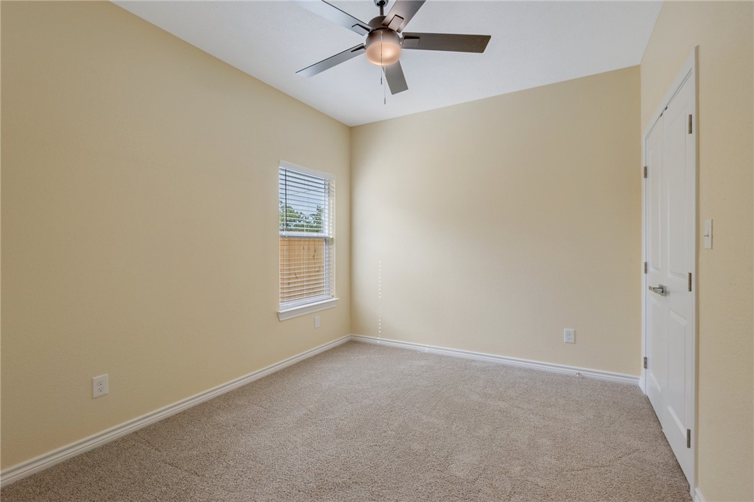 1108 Richard Street, Unit A Bryan, TX 77803 - Photo 12 of 22 Spare room featuring light colored carpet and a ceiling fan