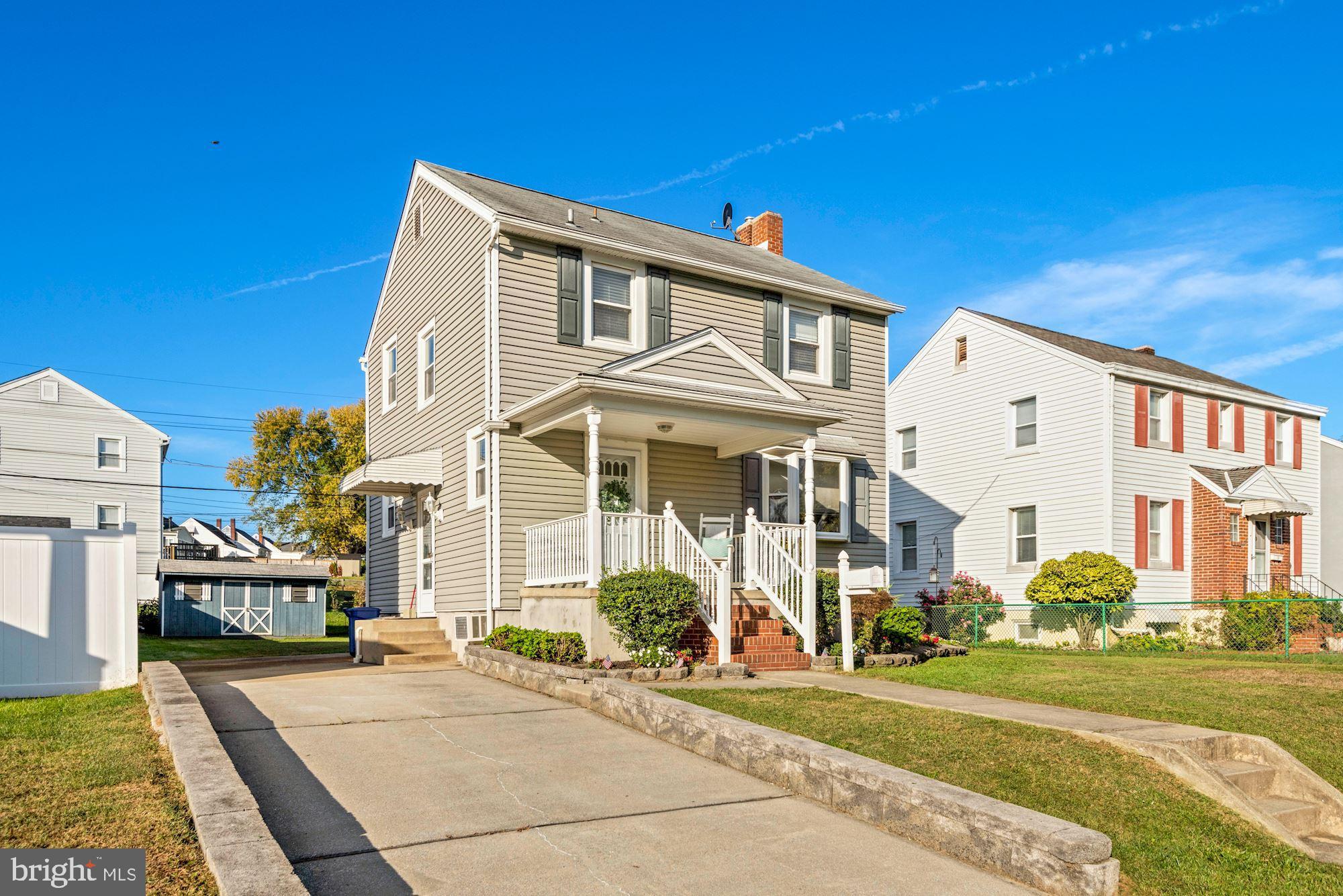5524 Ashbourne Road Baltimore, MD 21227 - Photo 2 of 23 a front view of a house with a yard