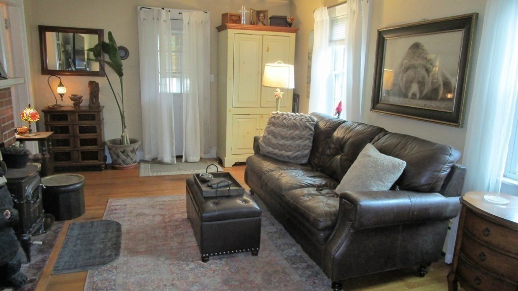 45 Upton Street Springfield, MA 01104 - Photo 11 of 19 a living room with furniture and a painting on the wall