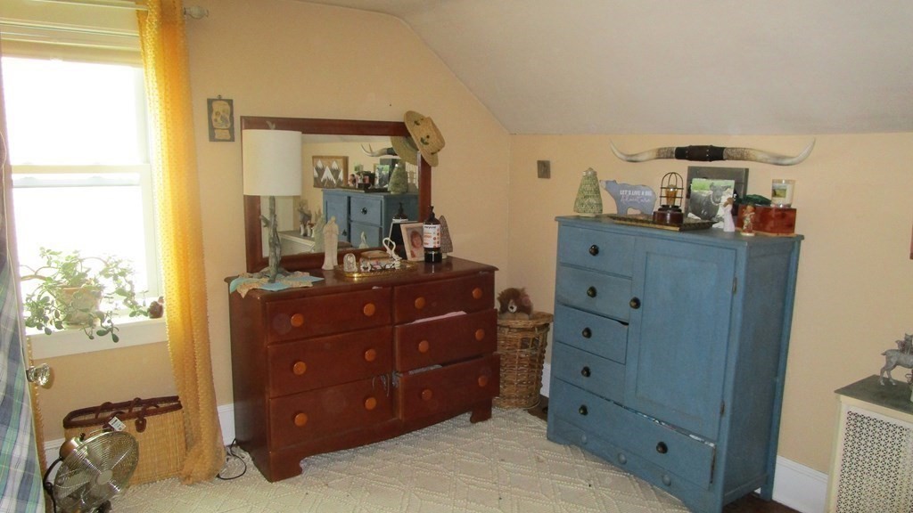45 Upton Street Springfield, MA 01104 - Photo 14 of 19 a room with a dresser and a mirror