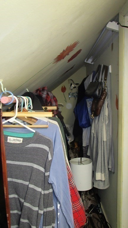 45 Upton Street Springfield, MA 01104 - Photo 17 of 19 a view of walk in closet with clothes and shoes