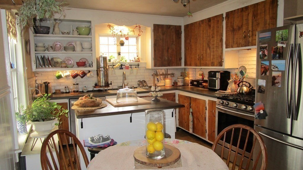 45 Upton Street Springfield, MA 01104 - Photo 6 of 19 a kitchen with a sink appliances cabinets and a window