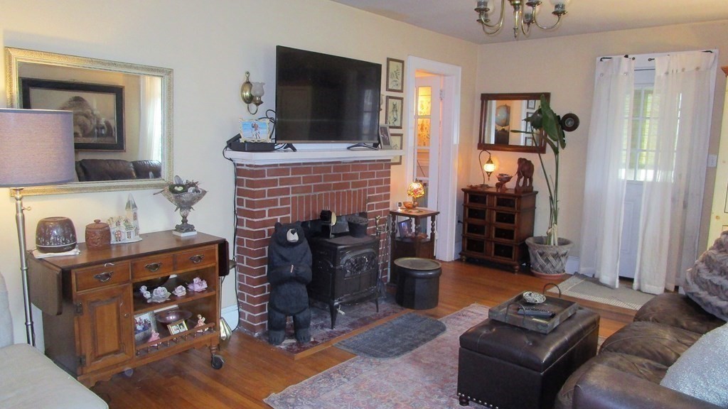 45 Upton Street Springfield, MA 01104 - Photo 10 of 19 a living room with furniture and a flat screen tv