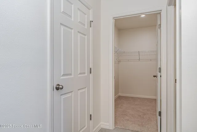 a view of a hallway with closet area