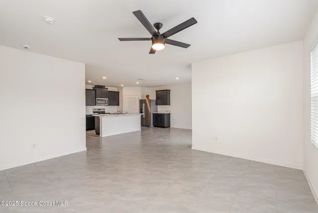 a view of a kitchen with a sink and cabinet